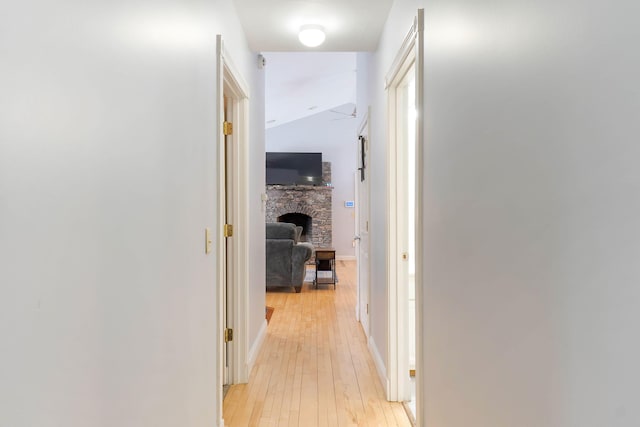 corridor featuring light wood finished floors