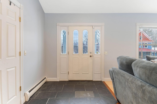 foyer featuring baseboards and baseboard heating