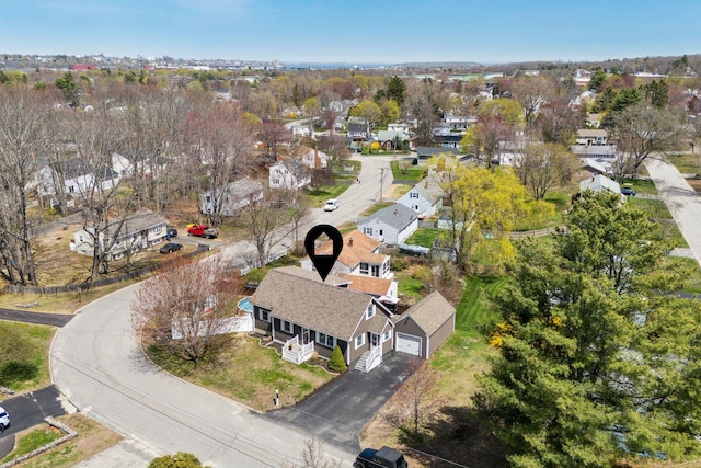 birds eye view of property with a residential view