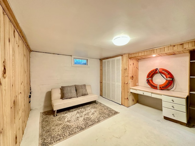 living area featuring concrete floors