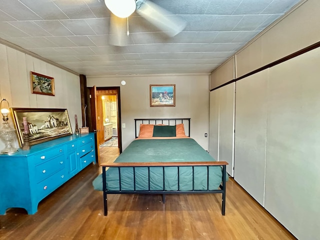 bedroom with wood finished floors