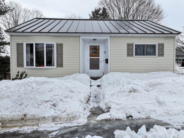 view of front of property with a standing seam roof and metal roof