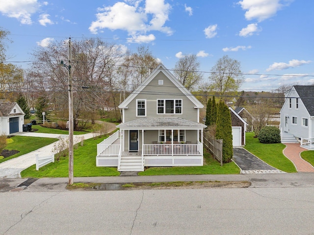 49 Langsford Rd, Kennebunkport, ME 04046 - farmhouse with covered porch, an outbuilding, a front yard, and asphalt driveway