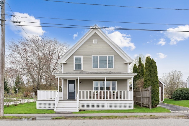 49 Langsford Rd, Kennebunkport, ME 04046 - view of front of house featuring covered porch and a front lawn