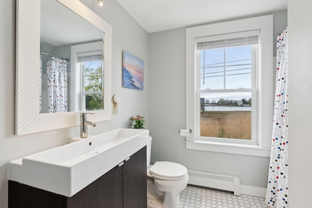 49 Langsford Rd, Kennebunkport, ME 04046 - bathroom featuring a baseboard radiator, toilet, vanity, and a water view