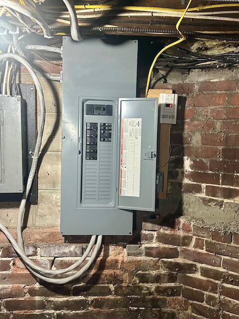 utility room featuring electric panel