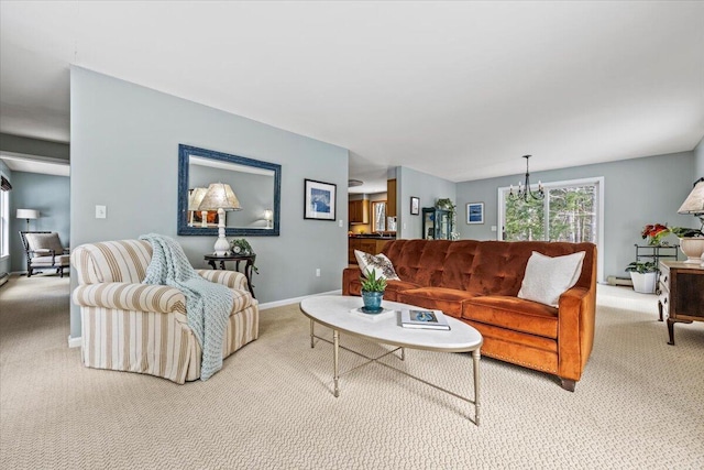 living area featuring baseboards, carpet, and a chandelier