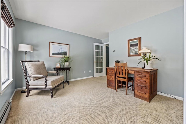 office area featuring a baseboard heating unit, light colored carpet, and baseboards