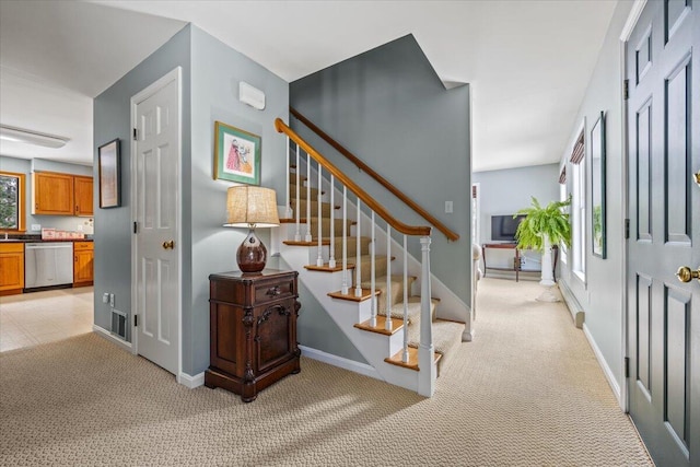 staircase with carpet flooring and baseboards