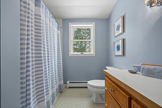 bathroom with baseboard heating, toilet, vanity, and a shower with curtain