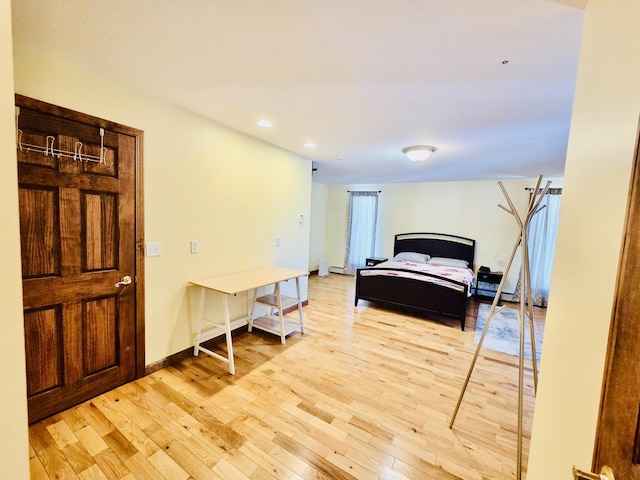 bedroom featuring recessed lighting, light wood-type flooring, and baseboards