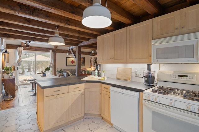 kitchen featuring dark countertops, light brown cabinets, beamed ceiling, a peninsula, and white appliances