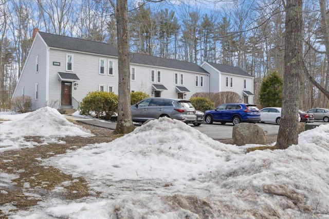 townhome / multi-family property with a chimney