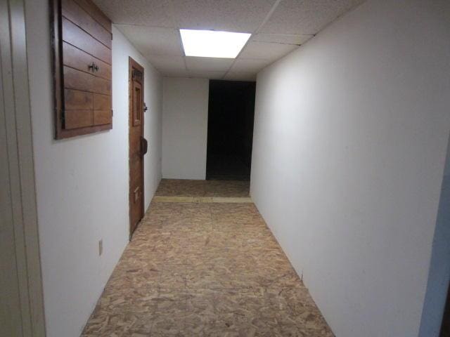 131 Clover St, Madawaska, ME 04756 - hallway featuring a paneled ceiling