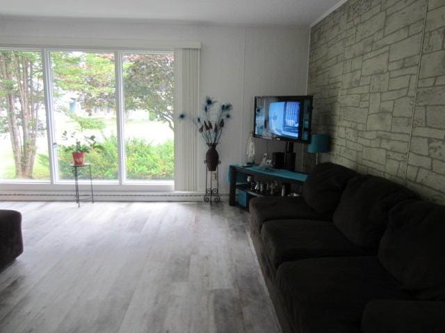 131 Clover St, Madawaska, ME 04756 - living area with wood finished floors