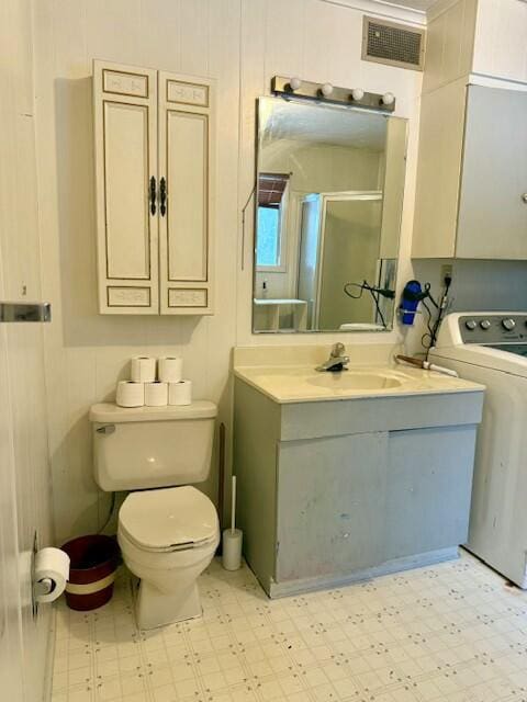 131 Clover St, Madawaska, ME 04756 - full bathroom featuring washer / dryer, a stall shower, visible vents, and tile patterned floors