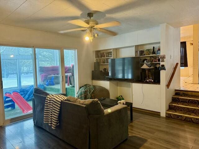131 Clover St, Madawaska, ME 04756 - living room with dark wood-style floors, ceiling fan, and stairway