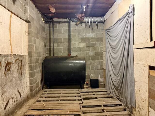 131 Clover St, Madawaska, ME 04756 - basement with concrete block wall and heating fuel
