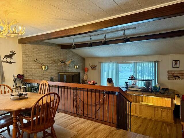 131 Clover St, Madawaska, ME 04756 - reception area with a brick fireplace and a notable chandelier