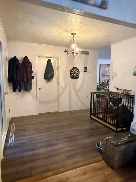 131 Clover St, Madawaska, ME 04756 - interior space featuring an inviting chandelier and wood finished floors