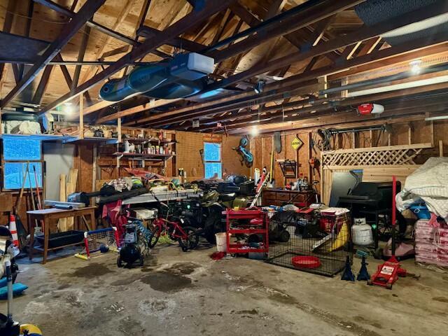 131 Clover St, Madawaska, ME 04756 - garage featuring a workshop area and a garage door opener