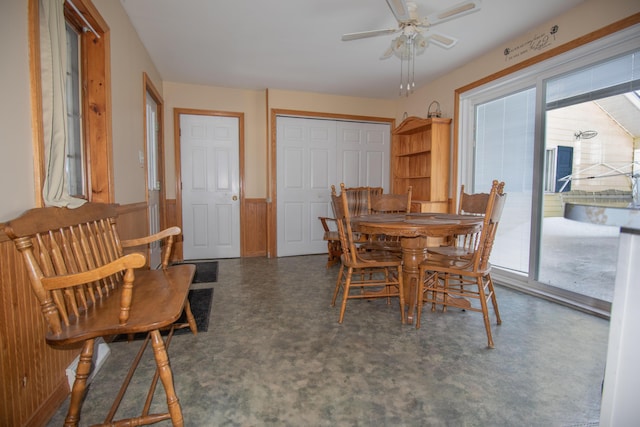 633 Main St, Madawaska, ME 04756 - dining room featuring wainscoting, ceiling fan, and a healthy amount of sunlight