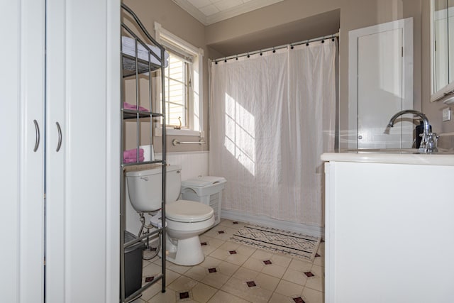 633 Main St, Madawaska, ME 04756 - full bath featuring a sink, tile patterned flooring, toilet, and ornamental molding