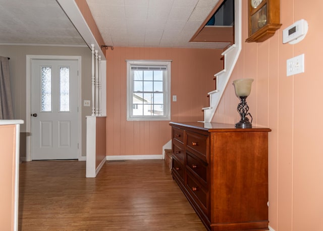 633 Main St, Madawaska, ME 04756 - foyer entrance with crown molding, stairs, baseboards, and wood finished floors