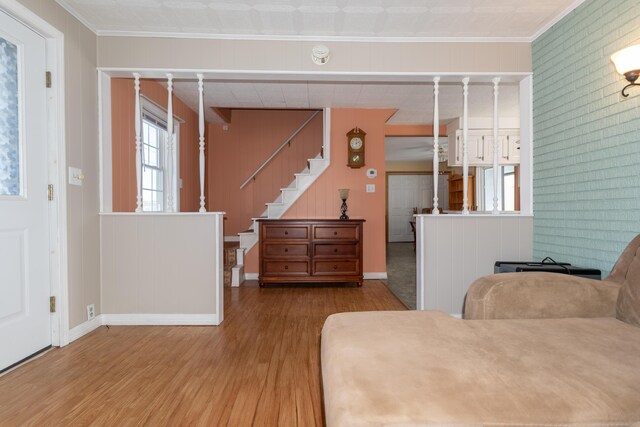 633 Main St, Madawaska, ME 04756 - bedroom featuring multiple windows, wood finished floors, baseboards, and ornamental molding