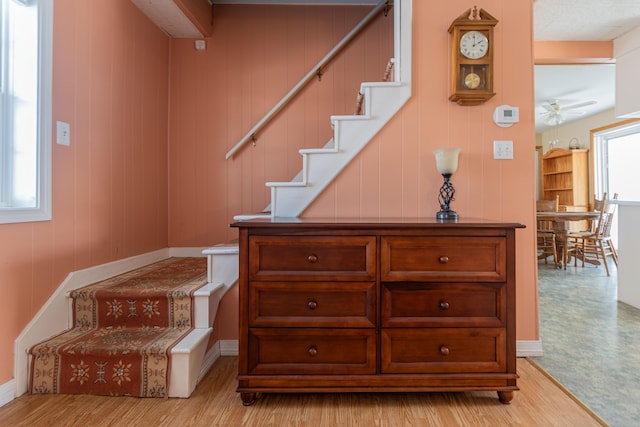 633 Main St, Madawaska, ME 04756 - stairs with a ceiling fan, baseboards, and wood finished floors
