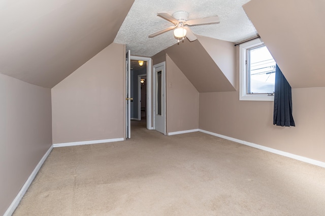 633 Main St, Madawaska, ME 04756 - additional living space featuring baseboards, ceiling fan, carpet, and vaulted ceiling