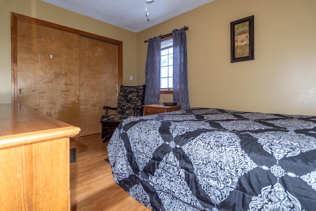 633 Main St, Madawaska, ME 04756 - bedroom with a closet and wood finished floors