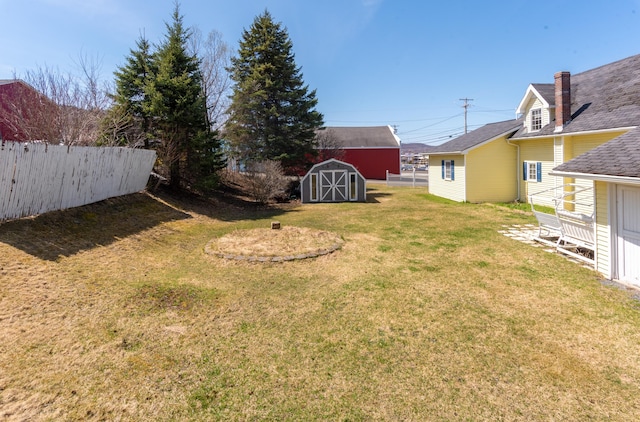 633 Main St, Madawaska, ME 04756 - view of yard featuring an outbuilding, a storage shed, and fence