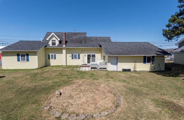633 Main St, Madawaska, ME 04756 - rear view of house featuring a shingled roof and a yard