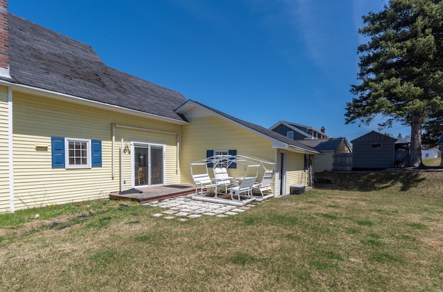 633 Main St, Madawaska, ME 04756 - back of property with a yard and a patio