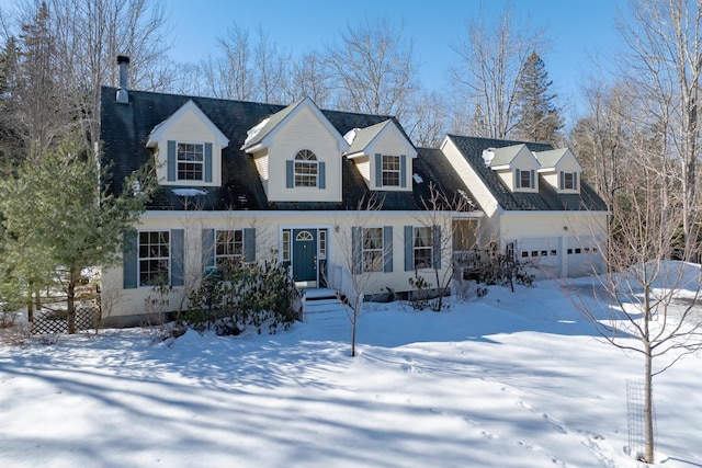 new england style home with a garage