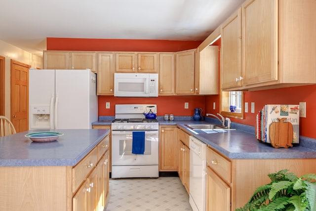 kitchen featuring light brown cabinetry, white appliances, and dark countertops