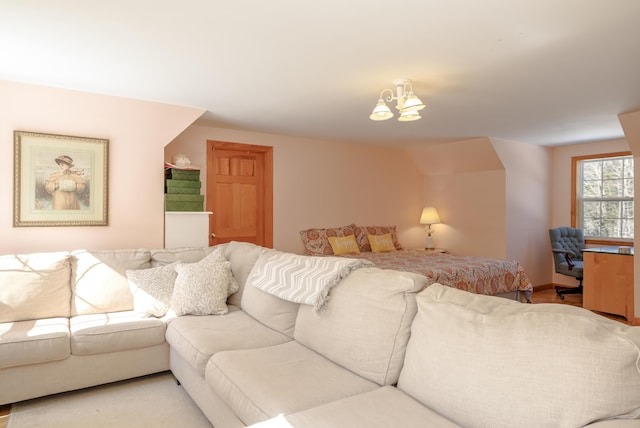 living area featuring a chandelier