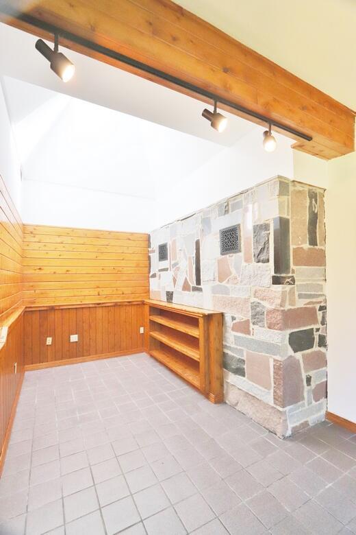 220 Church Rd, Bangor, ME 04401 - bonus room with lofted ceiling with beams, wood walls, and tile patterned floors