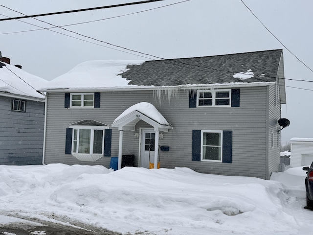 view of front of house featuring a shingled roof