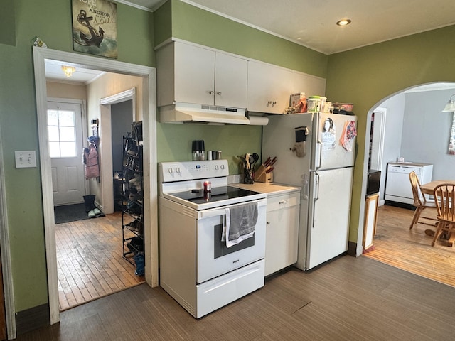 kitchen featuring white appliances, arched walkways, white cabinets, wood finished floors, and under cabinet range hood