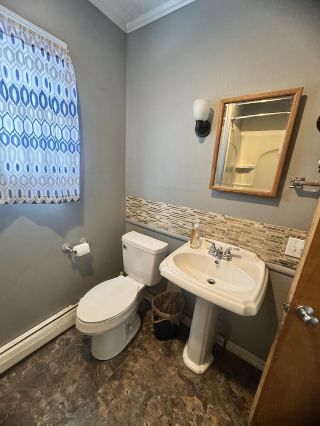 bathroom with ornamental molding, a baseboard radiator, toilet, and tasteful backsplash