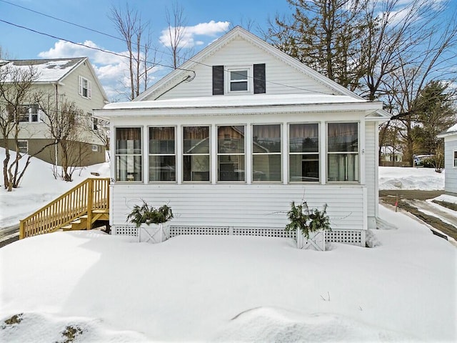 view of front of home featuring a sunroom