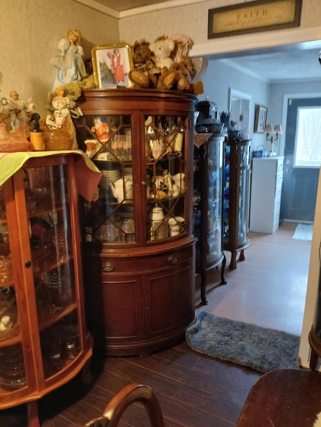 bar featuring dark wood-type flooring