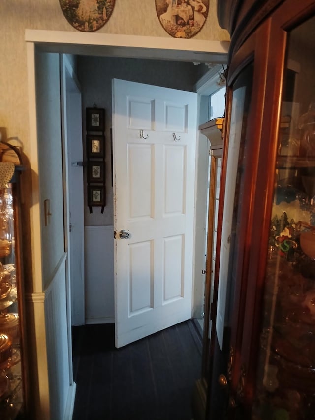 corridor with dark wood-type flooring