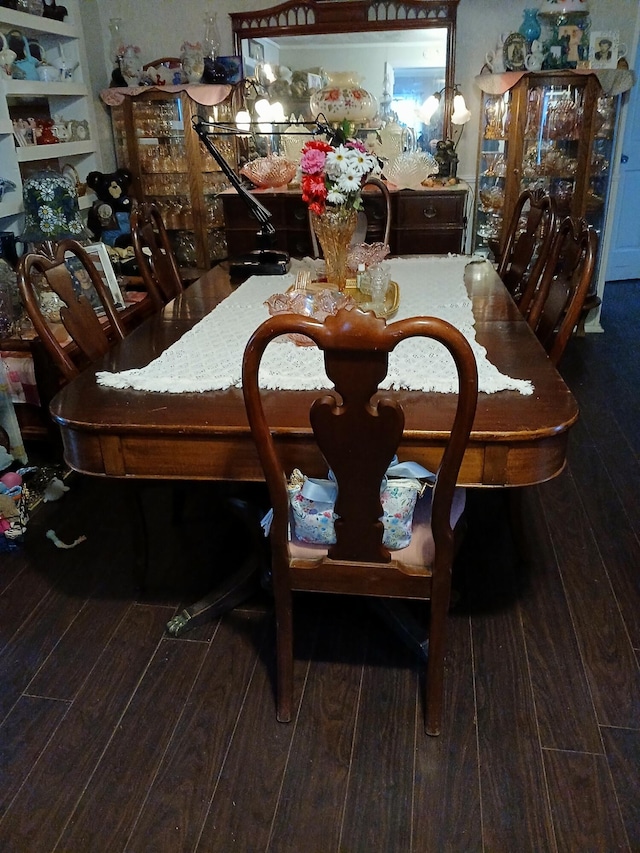 dining area with hardwood / wood-style floors