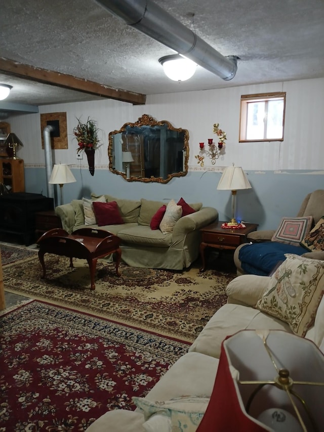 living area featuring a textured ceiling and a wood stove