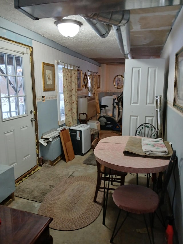 dining room with a textured ceiling