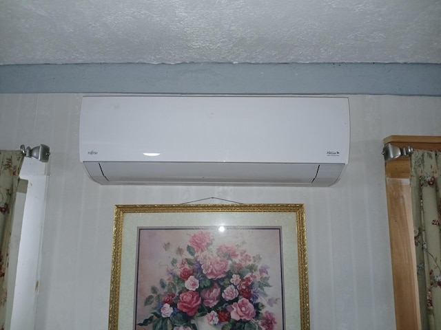 interior details with a wall mounted AC