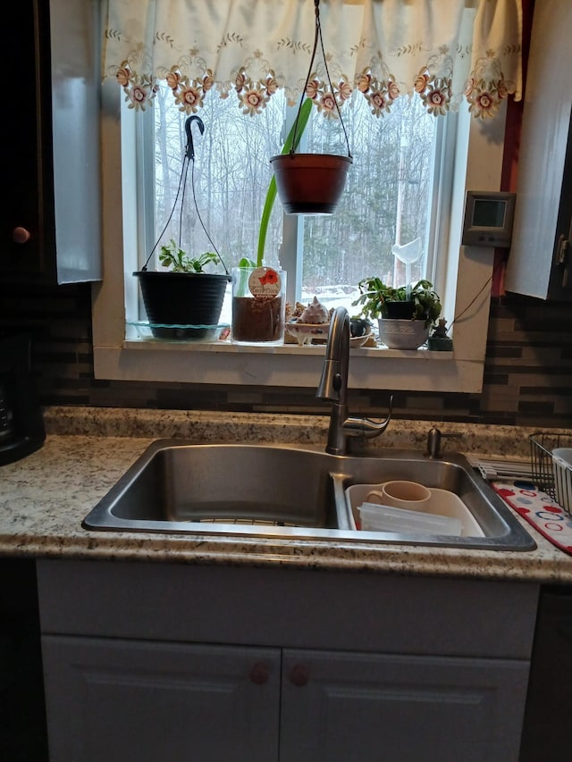 details with a sink and dishwashing machine